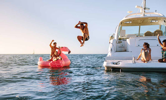 A boy on a boat swim platform