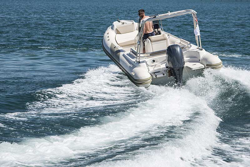 Man driving a speedboat on a lake