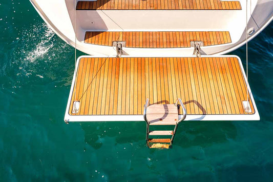 A wooden swim platform on a boat.