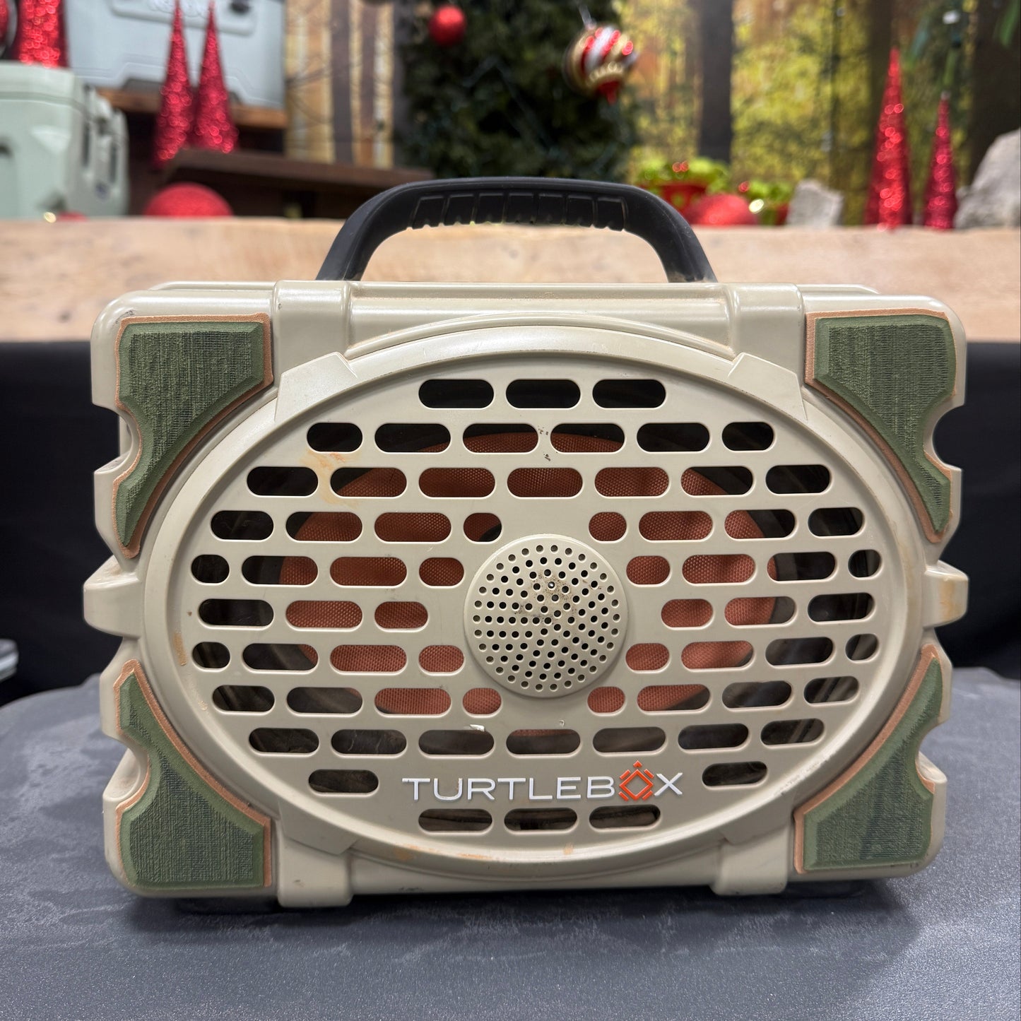 Turtle Beach speaker on a car dashboard with a festive background