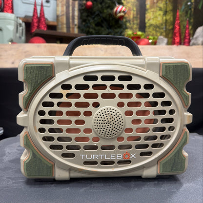 Turtle Beach speaker on a car dashboard with a festive background