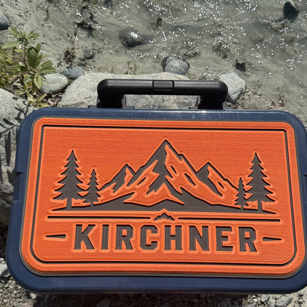 Kirchner personalized cooler top pad with mountains and pines, orange foam, by a river