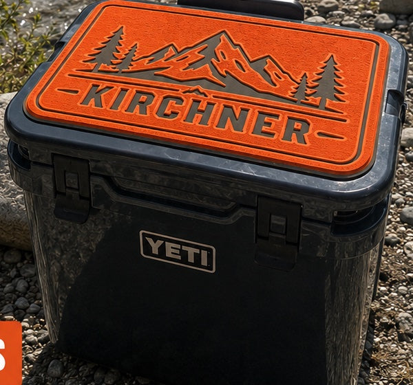 Kirchner mountain scene cooler top pad with name on a Yeti cooler
